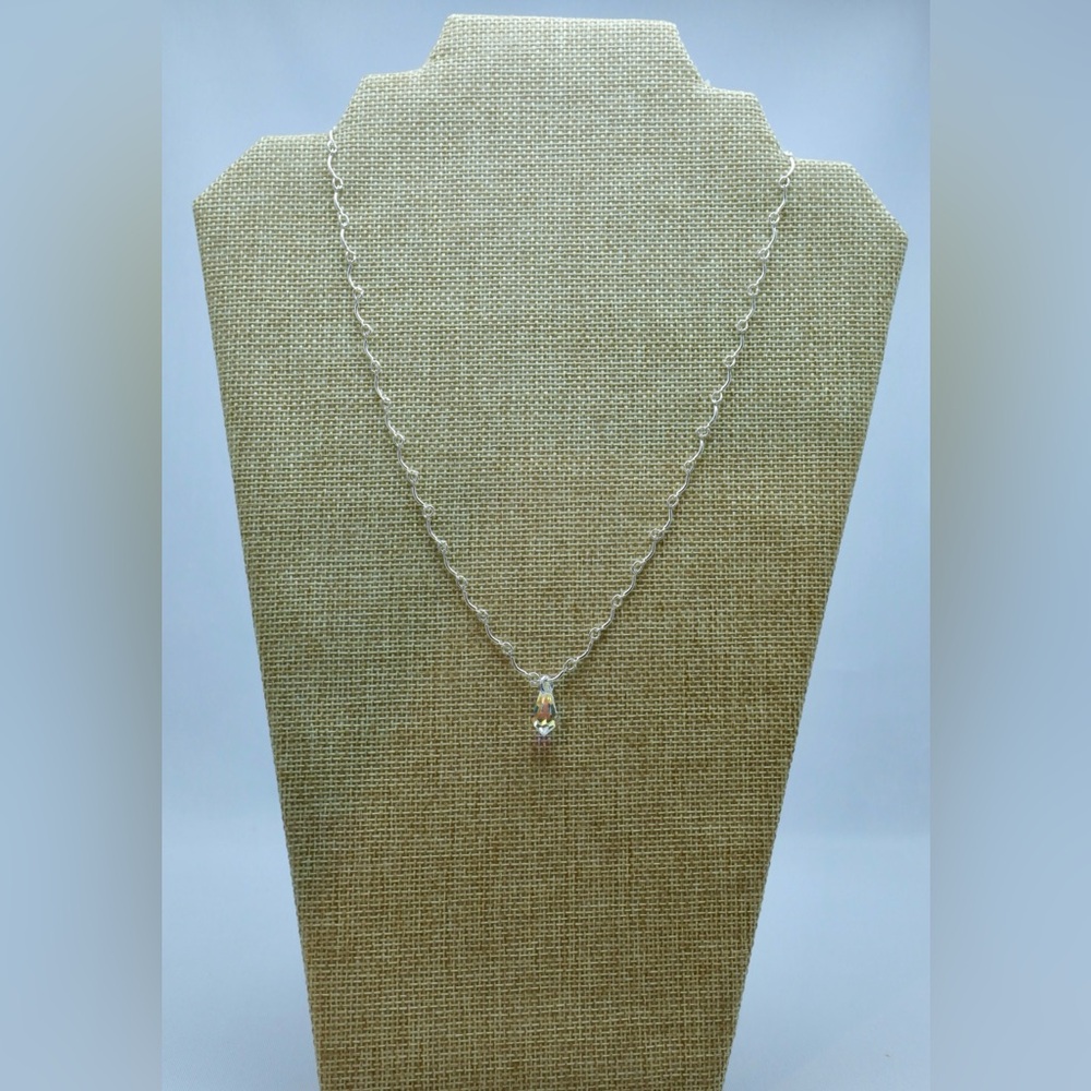Crystal tear pendant on a delicate silver tone chain.